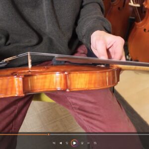 REMIC V5200 being mounted on violin