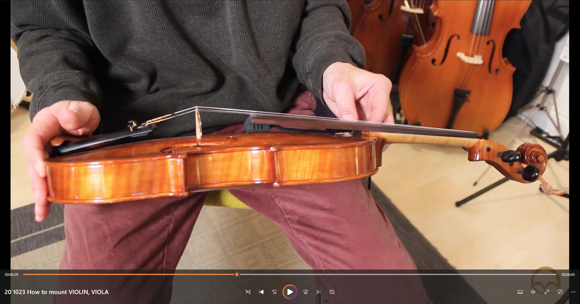 REMIC V5200 being mounted on violin